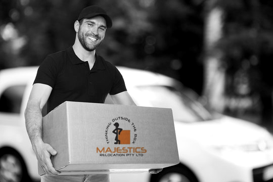 Majestics removalist carrying cartons during a Melbourne house move